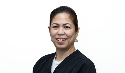 Smiling team member headshot on a white backdrop